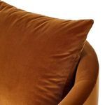 Close-up of pillow corner showing soft velvet fabric and fine stitching