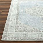 Detailed corner view highlighting the border stitching and pile of Lila Denim/Seafoam rug