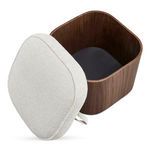 Detached padded seat shows oatmeal fabric texture and black inner base lining