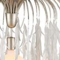 Close-up of silver metal base and top curved arms from pendant showing metallic texture