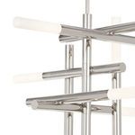 Close-up of chrome arms intersecting with frosted acrylic light diffusers at ends