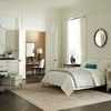 Casey Side Table in bedroom setting with light walls, rug, and layered furniture