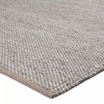 Low-angle view highlighting rug’s tight weave pattern and finished edges