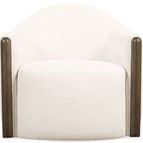 Front-facing view with broad rounded back, plush seat, and vertical dark wood trim on each side