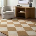 Isaac Ivory Handmade Rug styled in modern living room with armchair and wooden console