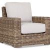 Havana Club Chair with ample proportions, premium all-weather wicker in rich Aged Tobacco, beige seat and back cushions