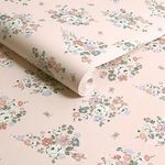 Close-up of wallpaper roll showing texture and detailed floral pattern on matte finish