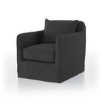 Angled shot from side focusing on chair’s rounded cushion and slipcover fit