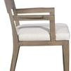 Side profile showing chair’s straight armrest and thick seat cushion depth