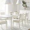 Dining space featuring six Ridge Dining Arm Chairs paired with a rectangular table and natural light