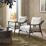 Two Kimmery Chairs in neutral-toned room beside a dark wood sideboard and framed art