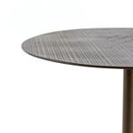 Angled close-up of table's thin top edge with patterned acid-etched surface