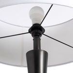 Interior view under white drum shade focusing on LED bulb and metal fixture details