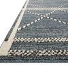 Low angle side view of Fabian Denim Charcoal rug showing pile height and textured diamond borders