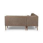 Rear view showing clean, straight-lined banquette back and legs in warm brown linen fabric.