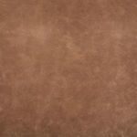 Detailed close-up of the brown Coris leather surface with natural grain and texture visible