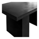Close-up corner detail highlighting textured surface of concrete table top and leg