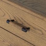 Angled view emphasizing rounded corners and smooth oak finish
