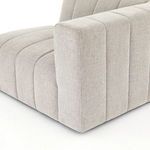 Detail of vertical channel stitching at the intersection of right arm and seat cushion
