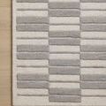Top corner close-up highlighting alternating high-low pile and linear stripe detail