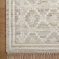 Close-up showing fringed edge and woven texture on ivory Rivers Lagoon rug