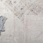 Top-down comparison showing three different light gray and ivory patterned rugs overlapping
