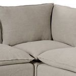 Corner close-up showing detailed seam joins and plush feather-blend cushions