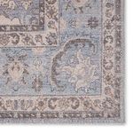 Close-up focused on intricate border design and floral corner details