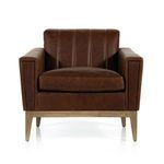 Front-facing view highlighting vertical leather stitching on backrest and plush seat cushion.