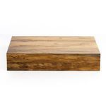 Backgammon board open on wood coffee table in cozy living room setting with modern furniture and lit fireplace