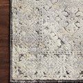 Theory Grey / Sand modern rug corner view with plush pile and subtle geometric pattern on wood floor