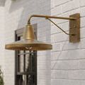 Outer view of brass sconce installed on exterior wall emphasizing arm structure and mounting hardware