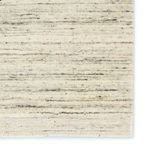 Zoomed detail of rug edge highlighting the hand finished selvage and woven pattern variations