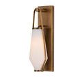 Angled view of sconce showing light diffusion through frosted glass from side and brass wall plate