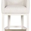 Front view of Ian stool highlighting tan colored metal footrest and light fabric seat