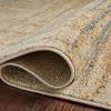 Close-up of the rug curled over to show soft texture and polypropylene weave