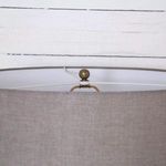 Top view showing lamp's finial and internal frame of grey cotton shade