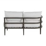 Back view of sectional sofa showing dual horizontal aluminum frame bars and cushion backs
