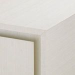 Close-up of sand white textured surface highlighting vertical subtle wood grain pattern