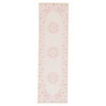 full length runner rug with three floral medallions and decorative narrow border