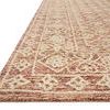 Low angled close-up view showing Cecelia Rust rug’s pile texture and detailed tufting on edge