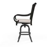 Side view highlighting scrolled armrest detail and swivel base of stool with sand cushion