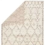 Beige area rug with a soft hand-spun wool texture featuring a classic Moroccan lattice pattern in ivory and brown