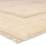 Close-up of rug corner showing soft texture and light fringe detail