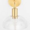 Front view showing clear glass dome shade and gold cylindrical socket with visible filament bulb