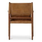 Rear view of Remy Dining Chair showing leather back and horizontal wooden support bar.
