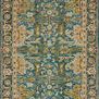 Navy and blue hooked wool rug with intricate gold and cream floral and geometric patterns, fringed edges