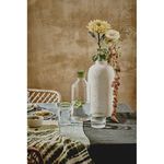 Tarifa Green Drinking Glass paired with matching pitcher and styled with vase and flowers on dining table