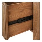 Close-up of metal drawer slide hardware inside bottom drawer of Caroline bookcase