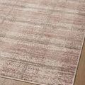 Angled close-up showing plaid pattern and subtle color variations of flatweave texture on hardwood floor
